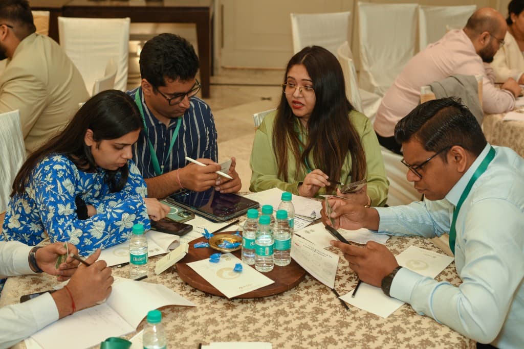 Small group focused on activity cards and mobile references